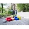 A composition of Cabrio armchairs in an open space