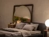 El espejo Odino par Porada en una habitación