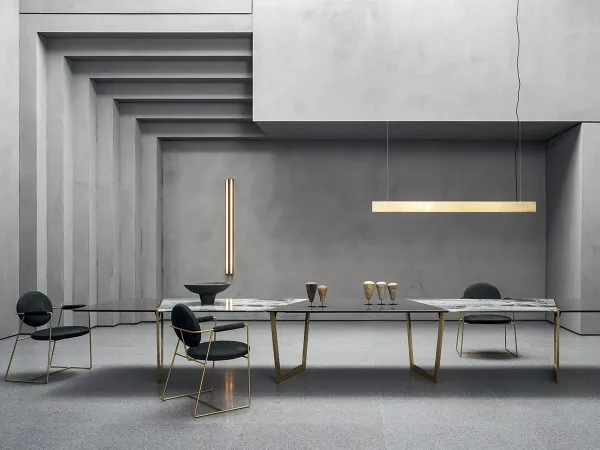 The Blade lamp in applique and suspension versions