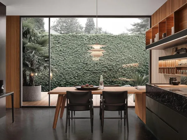 La cucina Convivium con tavolo penisola in una sala da pranzo