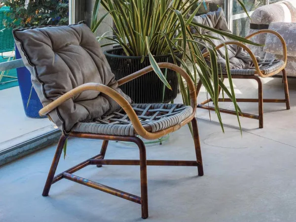 Manila armchair by Baxter with a cushion