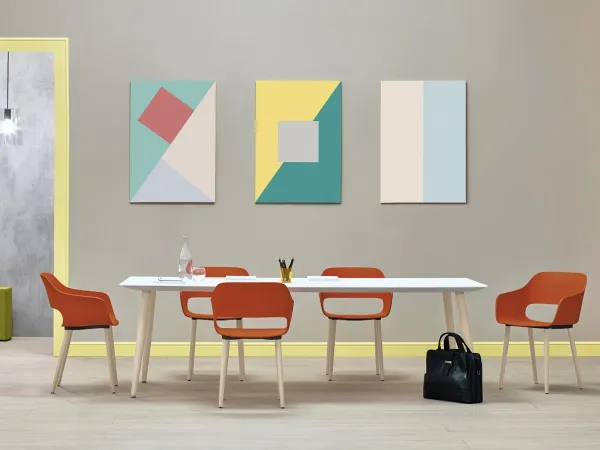 The Babila chair by Pedrali in a configuration with wooden legs