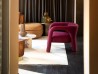 The Aimée armchair by Baxter in a living area