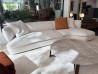 Flexform Quincy curved corner sectional sofa in light fabric at the Mobilificio Marchese showroom in Messina, Italy