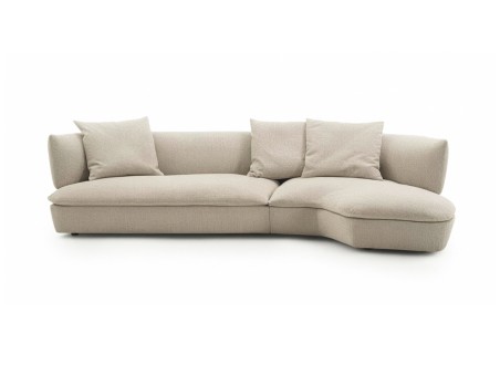 Flexform Quincy curved corner sectional sofa in light fabric at the Mobilificio Marchese showroom in Messina, Italy