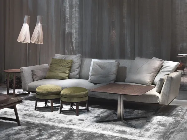Flexform Evergreen Sofa with coloured cushions, pouf and coffee table.